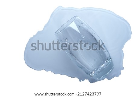 A glass of water lies on the table, top view. Puddle of water, isolated.