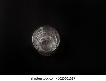 A Glass Of Water On A Black Background, A Place For The Text. Top View