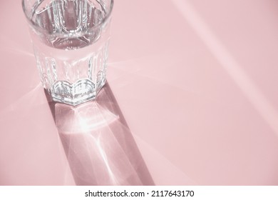 Glass Of Water On Pink, Sunlight And Shadow, Copy Space