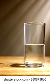 glass of water on a wooden table - Shutterstock ID 280873868