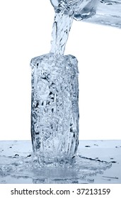 glass of a water with overflow on white background