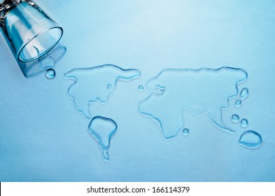 Glass Of Water Spilled Into Shape Of World Map