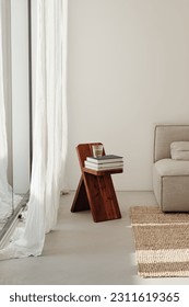 Glass of water wooden stool books - Shutterstock ID 2311619365