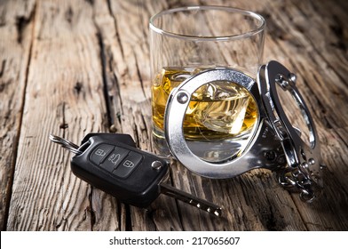Glass of whiskey and car keys, drinking and driving