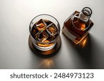 a glass of whiskey filled to the brim with ice cubes