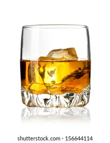 Glass of whiskey and ice isolated on white background. With clipping path
