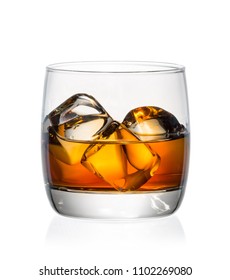 Glass of whiskey and ice on a white background