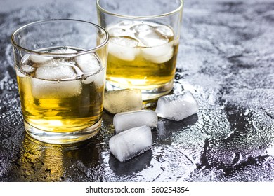 glass of whiskey on dark background