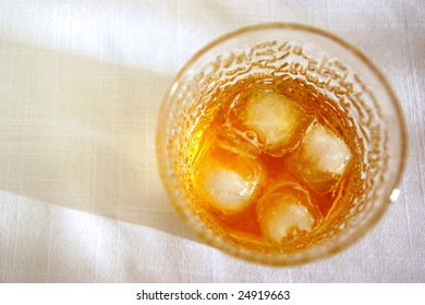 Glass Of Whiskey On The Rocks Seen From Above