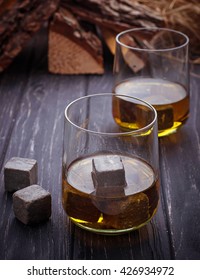 Glass of whiskey with stones. Selective focus
