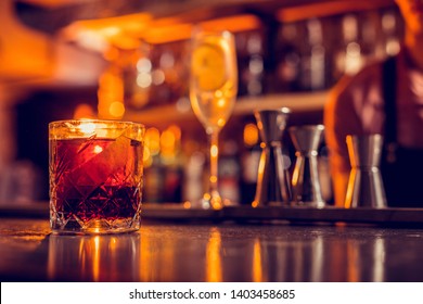 Glass With Whisky. Close Up Of Glass With Whisky Standing In The Bar Counter Near Other Cocktails