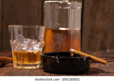 Glass Of Whisky And Lighted Cigar In An Ash Tray