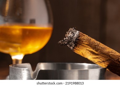 Glass Of Whisky And Lighted Cigar In An Ash Tray