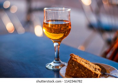 A Glass Of White Dessert Wine On A Table In A Cafe