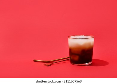 Glass Of White Russian Cocktail On Red Background