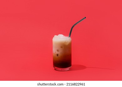 Glass Of White Russian Cocktail On Red Background