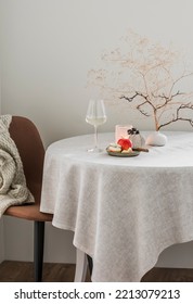 A Glass Of White Wine, An Apple, A Decorative Bouquet On The Table In A Cozy Living Room