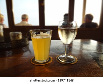 A Glass Of White Wine And Beer