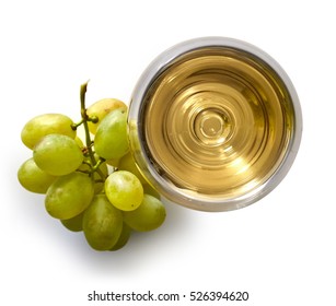 Glass of white wine and grapes isolated on white background from top view