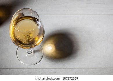 Glass Of White Wine On Wooden Table. Top View