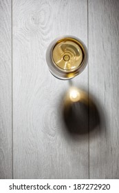 Glass Of White Wine On Wooden Table. Top View