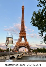 Glass of white wine in Paris with Eiffel Tower - Shutterstock ID 2194226671