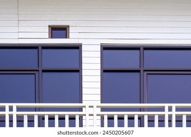 Glass Window and Door on Exterior White Artificial Wooden Wall with Aluminium Metal Steel balustrade Fence on Balcony Terrace of Vintage 2 storey House Building, Architecture Modern Design  - Powered by Shutterstock