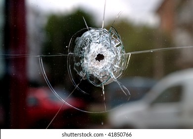 Glass window pierced by a shot