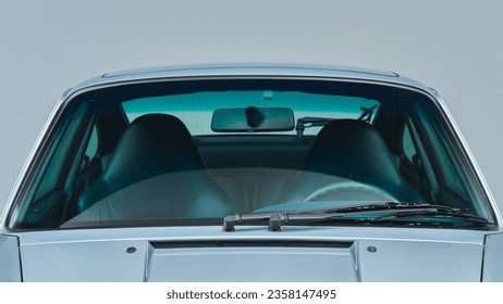 Glass windshield on a silver car