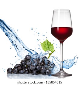 Glass Of Wine With Blue Grape And Water Splash Isolated On White