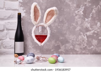 Glass Of Wine With Easter Decorations, Colorful Eggs On Table. Copy Space For Text.