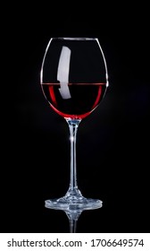 A Glass Of Wine On A Black Background