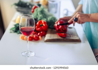 Glass Of Wine. Selective Focus Of A Glass With Alcoholic Drink Standing In The Kitchen