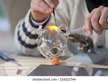 Glass Working Hands While Blowing With Fire A Piece Of Art 