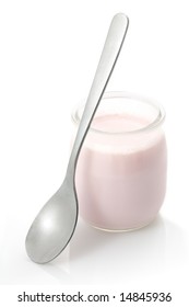 Glass Yogurt Pot With A Spoon Isolated On A White Background.