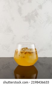 Glass Of Yuzu Iced Fizzy Lemonade With Passion Fruit And Orange Juice. Refreshing Iced Drink. Fruit Citrus Cocktail.