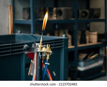Glassblowing Work Place and Torch Pilot Flame, close up horizontal photo