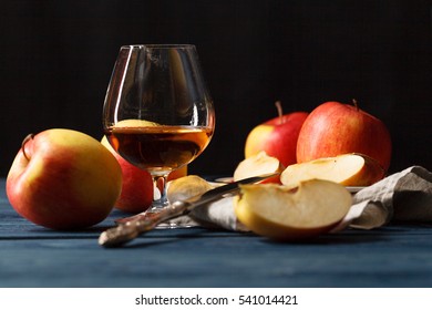 Glasse Of Calvados Brandy And Red Apples