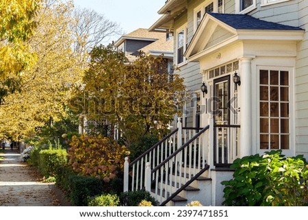 Glass-enclosed front entry of a house in an autumn day, Boston, MA, USA 
