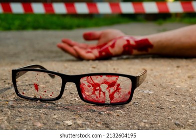 Glasses In Blood Bullet Hole. Crime Scene, Murder In The Head