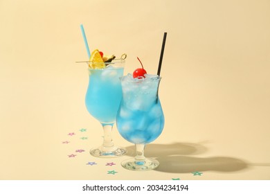 Glasses of Blue Lagoon cocktail on color background - Powered by Shutterstock