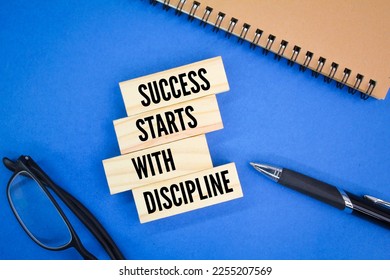 glasses, books and pens with the words Success starts with discipline. motivational quotes