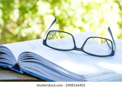 Glasses and books placed on table in the living room .Educational concepts and knowledge - Powered by Shutterstock