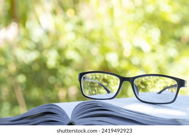 Glasses and books placed on table in the living room .Educational concepts and knowledge - Powered by Shutterstock