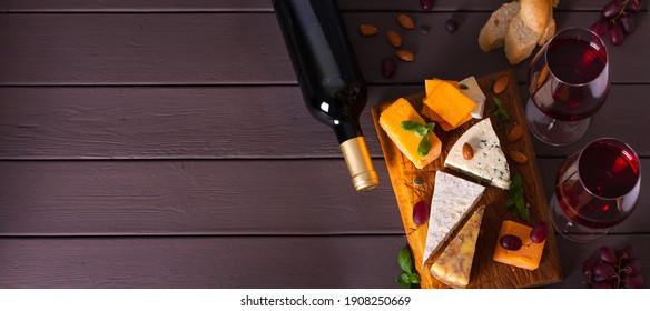 Glasses And Bottle Of Red Wine With Cheese And Nuts. View From Above, Top View. Copy Cpace, Banner