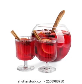 Glasses And Bowl Of Delicious Aromatic Punch Drink On White Background