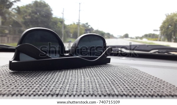 Glasses ,car,\
city, driving, fast, glasses, mirror, motion, road, safety, sky,\
speed, street, sun, traffic,\
travel