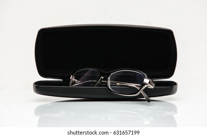 Glasses in a case on a white background