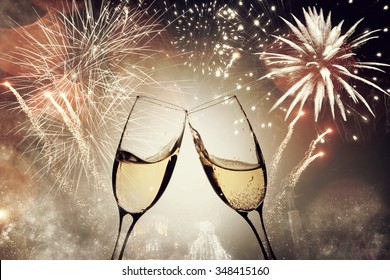 Glasses With Champagne Against Fireworks