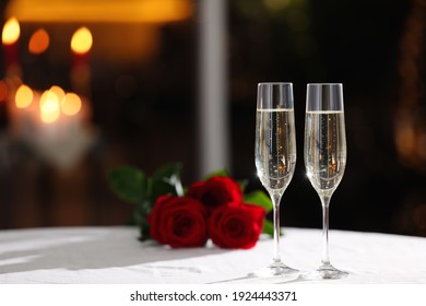 Glasses of champagne on table in restaurant, space for text. Romantic dinner - Powered by Shutterstock